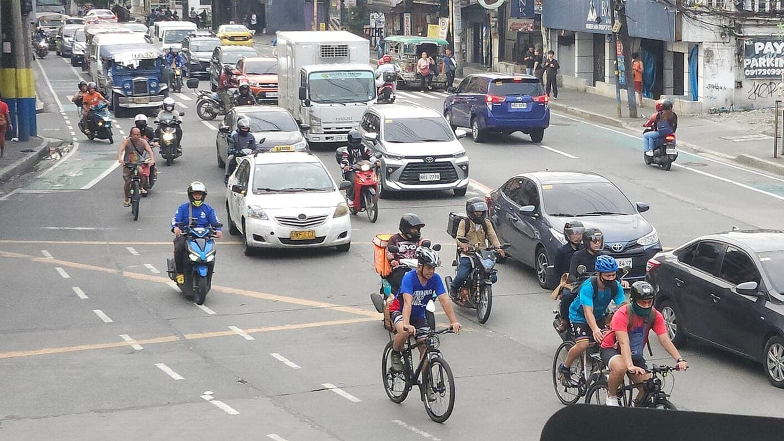 Cars and motorcycles in traffic along Shaw Boulevard, Mandaluyong, Metro Manila