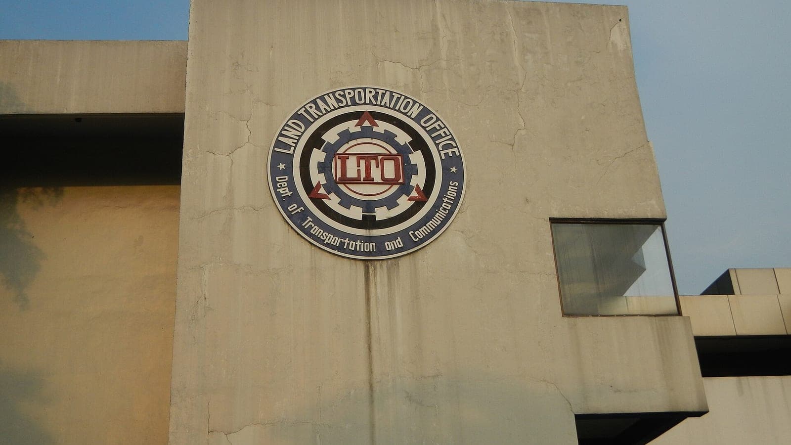 The Land Transportation Office seal on the facade of an LTO building in the Philippines